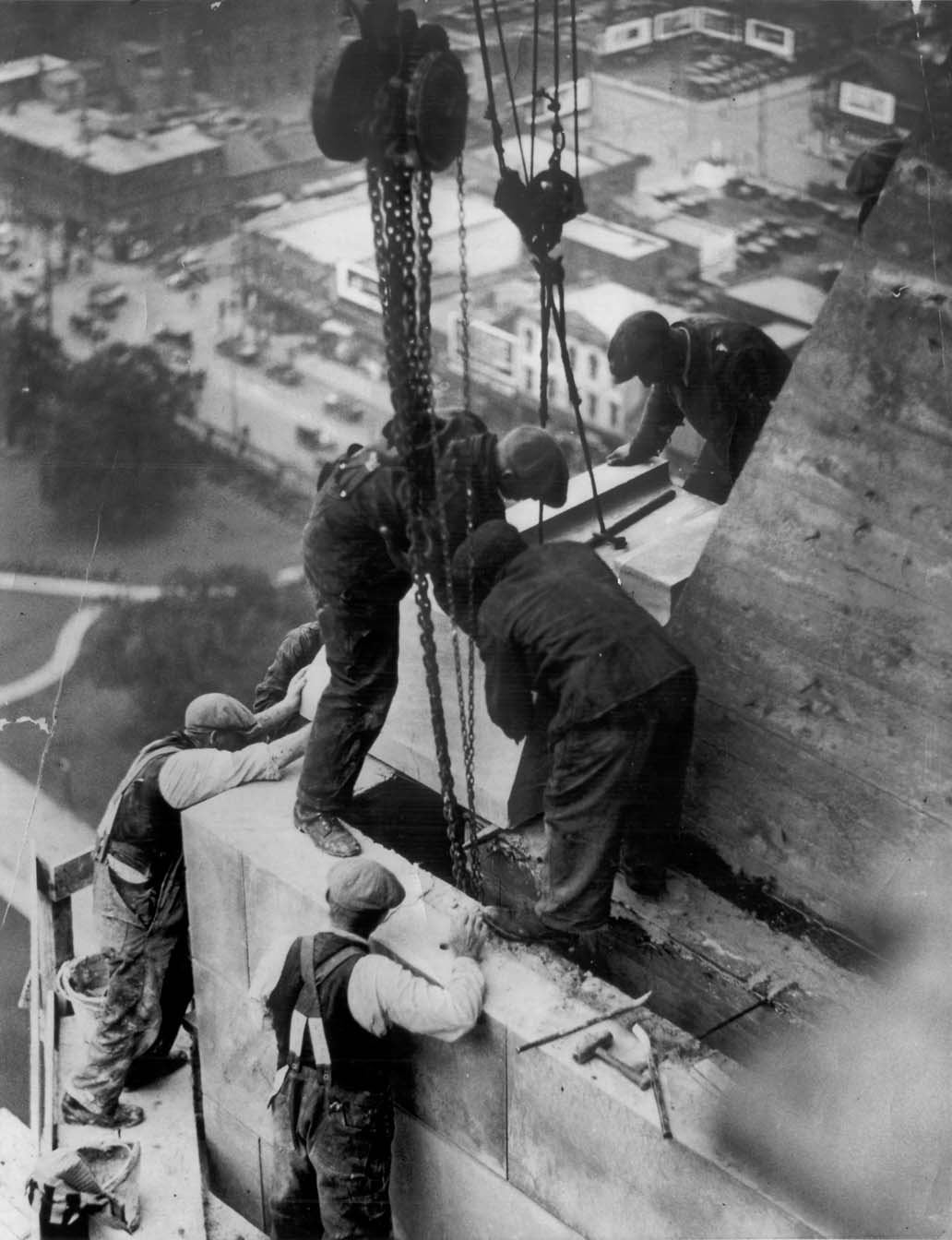 JAMES, William (1930) - Workmen laying last stone on the Canada Life Building