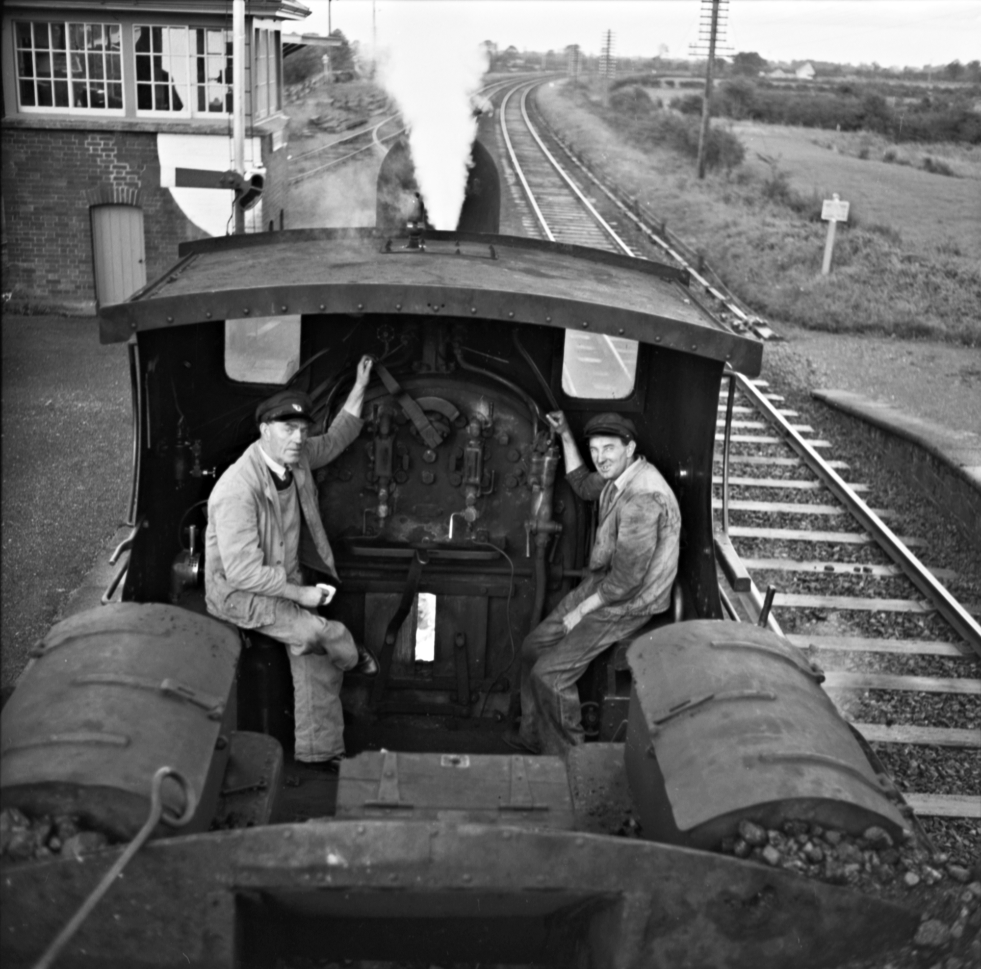 O'DEA (1962) - Interior view of driving cab with two drivers on train passing through Straffan railway station, Co. Kildare